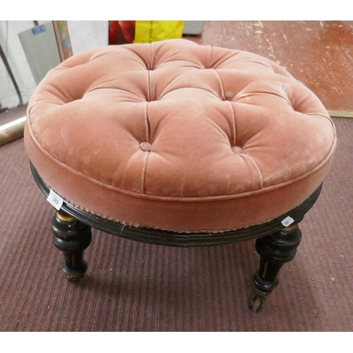 389 - Antique ebonised footstool on casters 