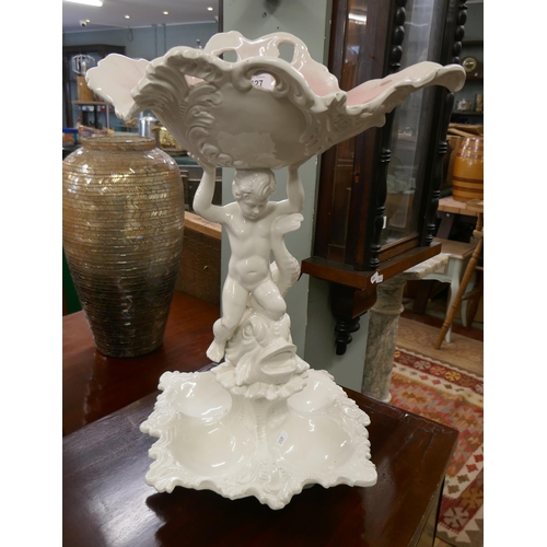 427 - White ceramic centrepiece depicting cherub and dolphin - Approx height 57cm