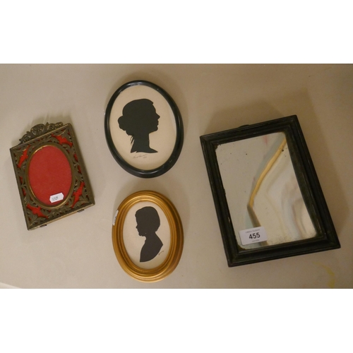 455 - 2 signed silhouettes together with small mirror and ornate picture frame  