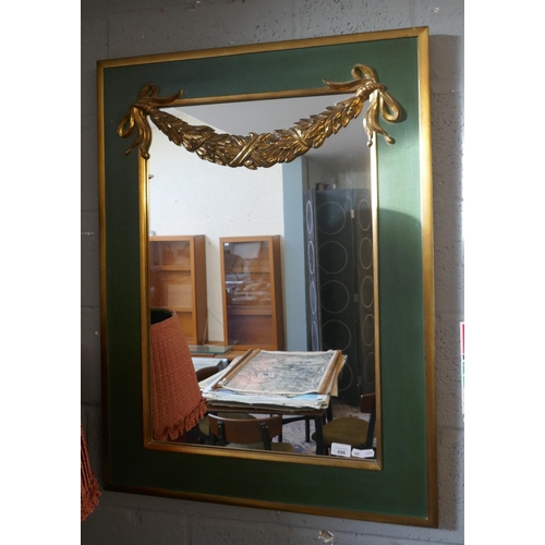496 - Gilt framed mirror adorned with gilt swag