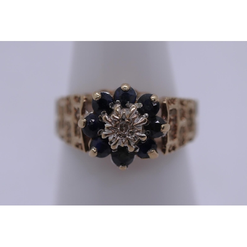61 - 9ct gold sapphire and diamond cluster ring - Size M