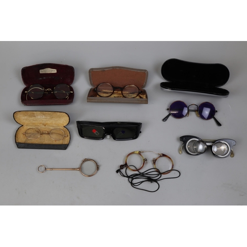 97 - An assortment of eye glasses and spectacles
