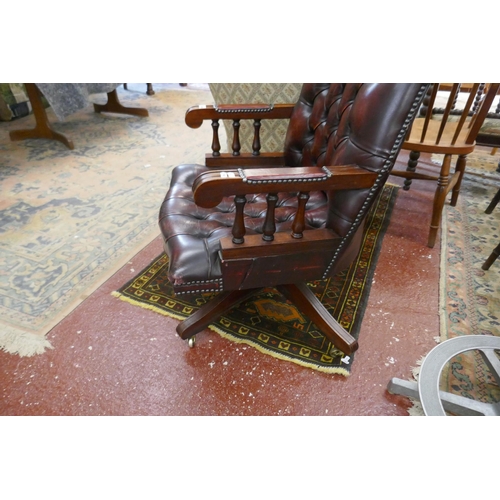 449 - Leather studded desk armchair on castors