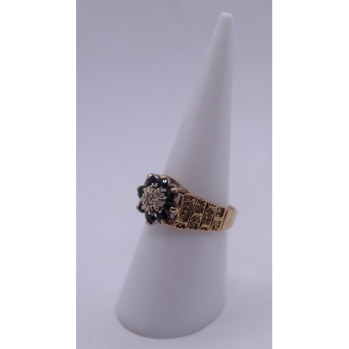 61 - 9ct gold sapphire and diamond cluster ring - Size M