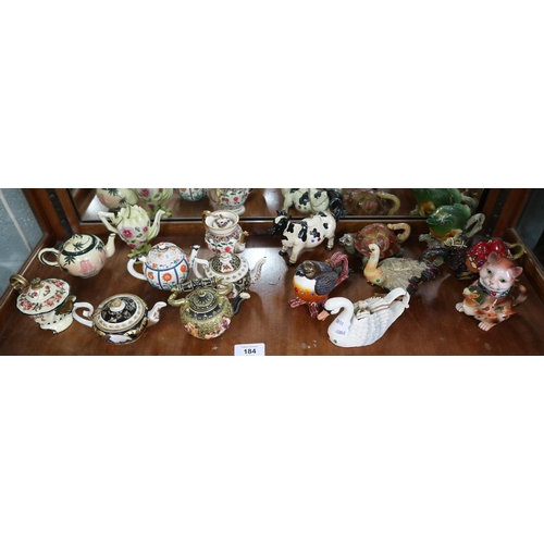 184 - Collection of miniature animals and decorative teapots