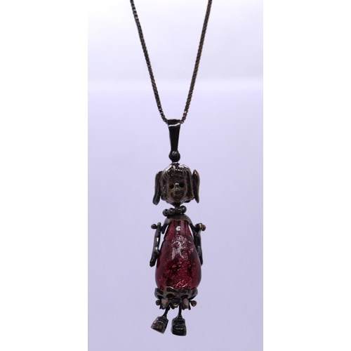 71 - Hallmarked silver necklace with articulated figure pendant