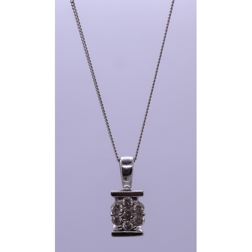 73 - 9ct white gold necklace and diamond set pendant