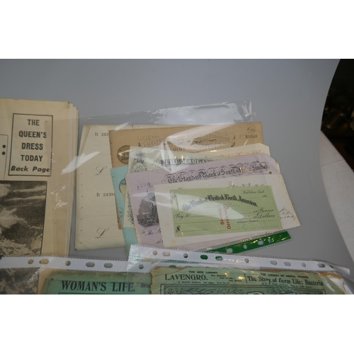 213 - Ephemera to include old newspapers, bank cheques etc