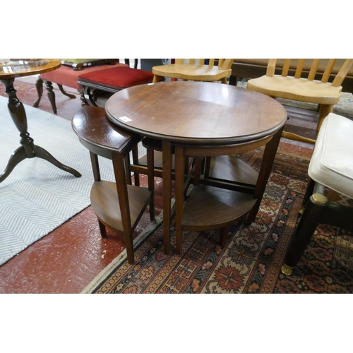 486 - Mid century circular coffee table with 4 small nesting tables