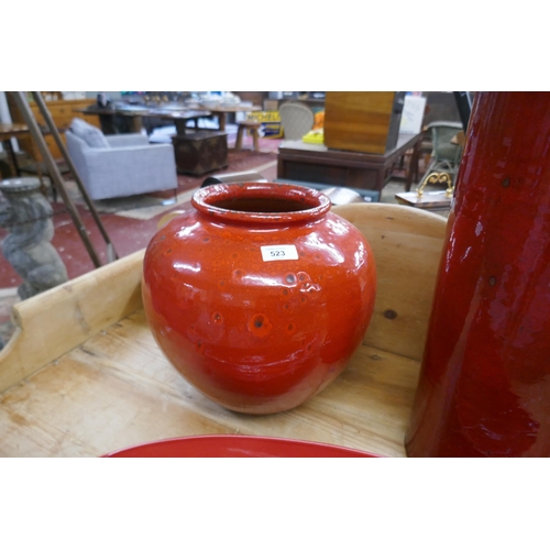 523 - 2 large red glazed vases together with a dish - Approx height of tallest: 68cm