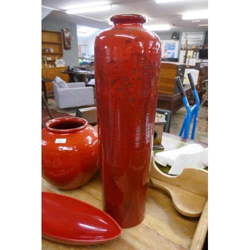 523 - 2 large red glazed vases together with a dish - Approx height of tallest: 68cm