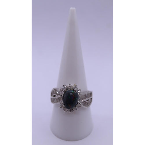 108 - Silver ring set with Ethiopian opal and CZ