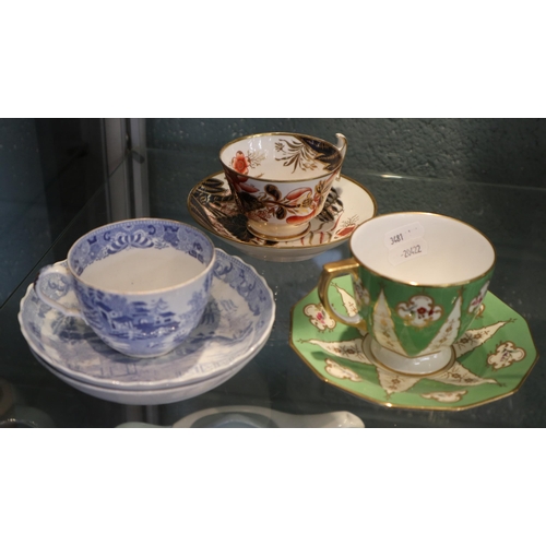 216 - 2 Spode 19thC porcelain cups & saucers  one in Imari palette the other with floral & gr... 