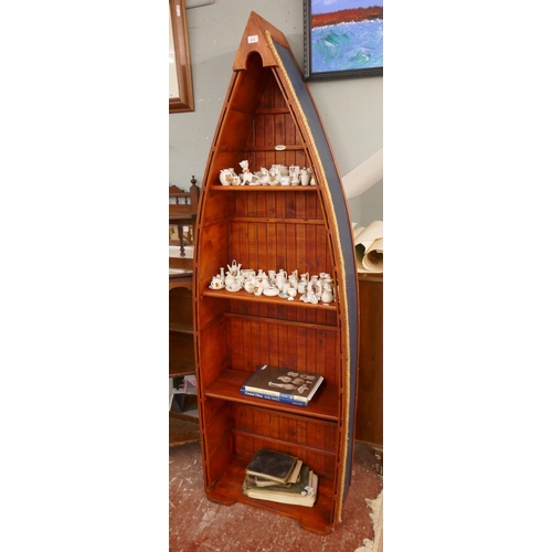 479 - Boat shaped shelf unit - Approx size: W: 66cm D: 28cm H: 203cm