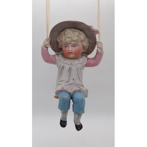 183 - 2 ceramic figures on swings - possibly German