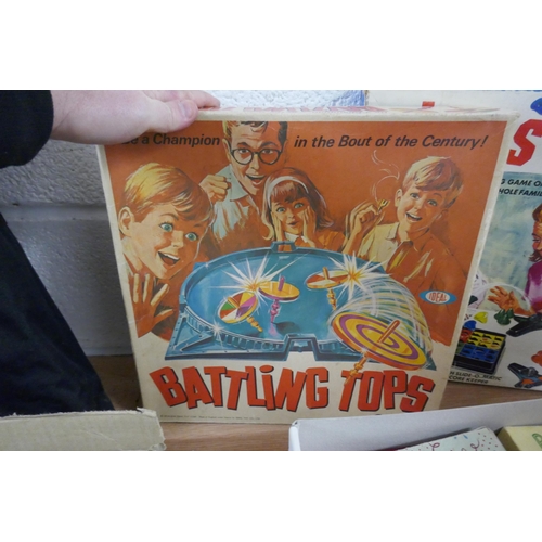 427 - Collection of vintage games to include Battling Tops, Hats Off and Bayko model building set