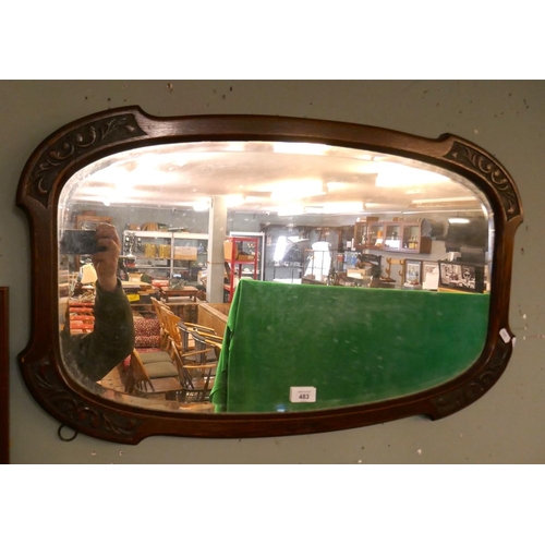 483 - Oak framed bevelled glass mirror