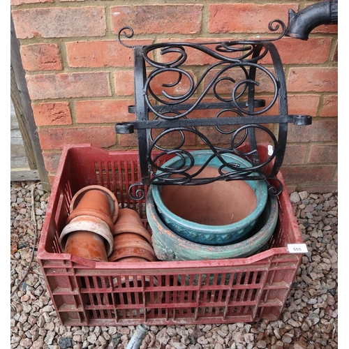 555 - Collection of garden pots together with a metal pot holder