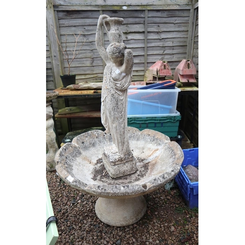 561 - Large stone fountain with female figurine holding a water bottle - Approx height 145cm