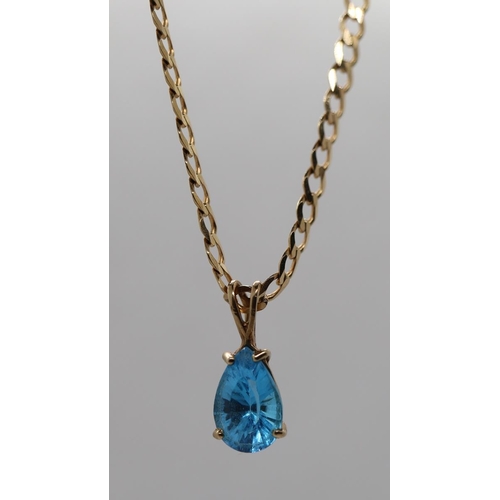 78 - 9ct gold Swiss blue topaz set pendant on 9ct gold chain with COA