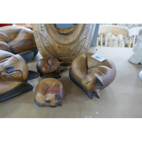 307 - Collection of wooden cats together with a tribal face mask