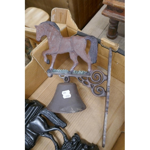 321 - 2 door stops in the form of a horse together with a bell