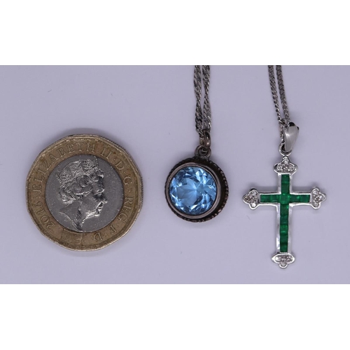 68 - 18ct white gold Emerald and diamond crucifix on 18ct white gold chain together with a silver pendant... 