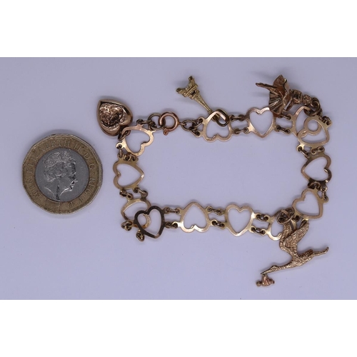 77 - 9ct gold charm bracelet