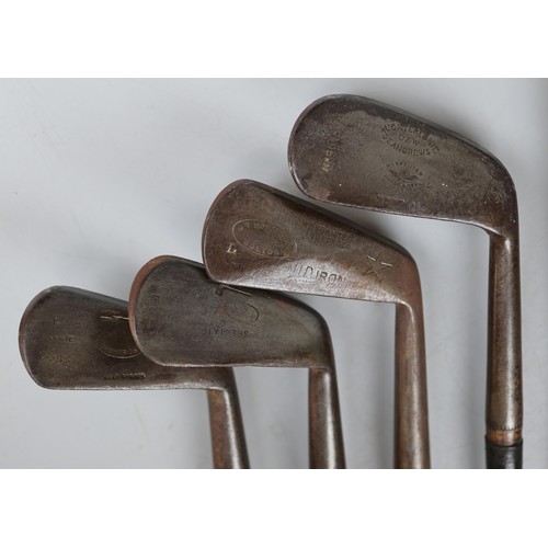 330 - Vintage golf clubs on presentation rack