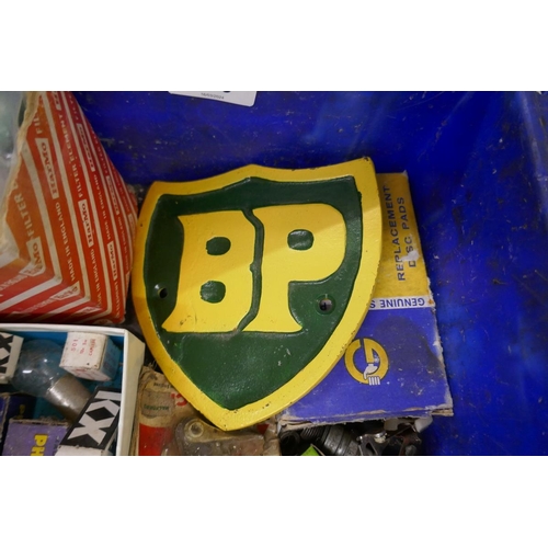 176 - Collection of car parts to include bulbs etc together with a BP cast iron sign