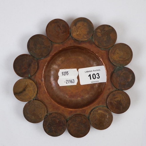 103 - Hand beaten copper pin dish with a ring of integrated coins