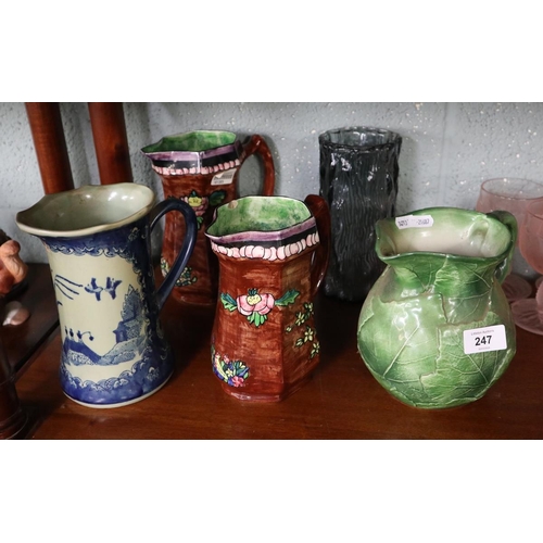 247 - Collection of ceramic jugs to include a glass vase