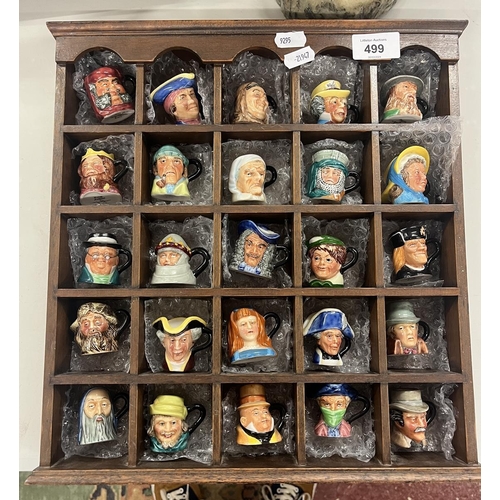 499 - 25 miniature Toby jugs in display case