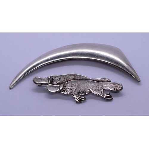 69 - 2 silver brooches - one in the form of two platypus