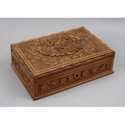 102 - Carved wooden box containing old coins