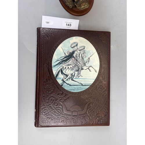 143 - Native American on horse figurine together with a book on the Great Chiefs