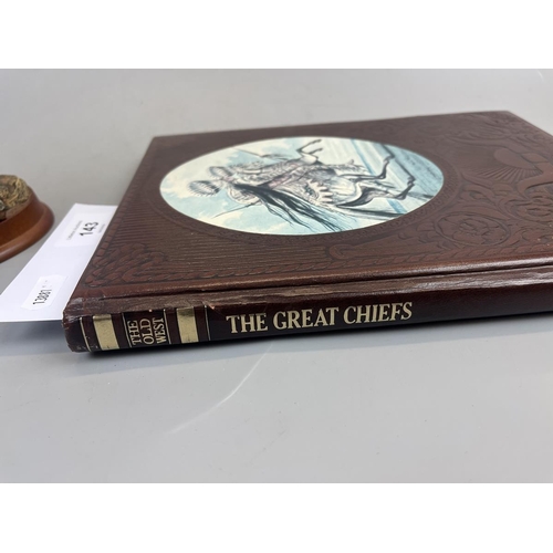 143 - Native American on horse figurine together with a book on the Great Chiefs