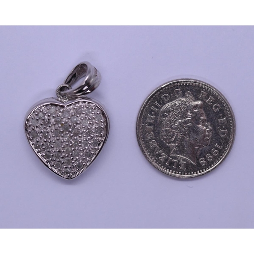 31 - 9ct white gold diamond set heart pendant