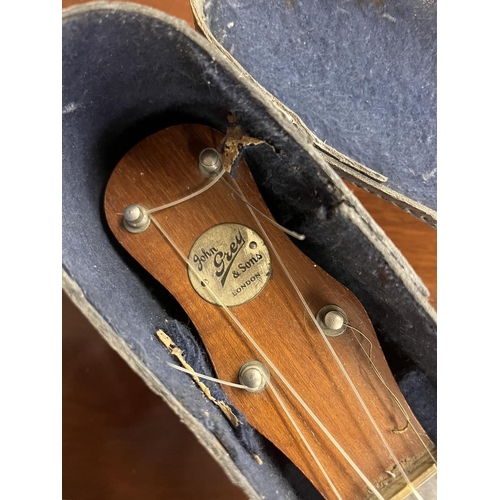 390 - Banjo in case by John Grey and Sons of London