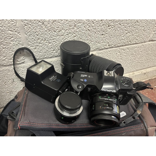 426 - Olympus 35mm camera OM101 with lenses, tripod together with a VHS video camera