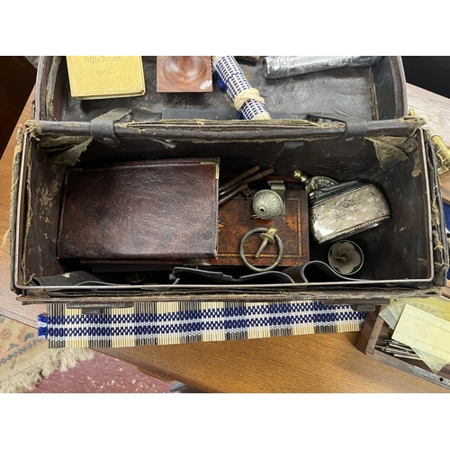 461 - Small leather trunk full of interesting collectables