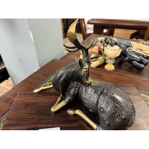 477 - Brass sculpture of a stag on wooden base
