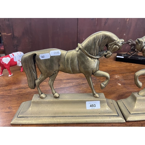 493 - Pair of brass flat back horses 