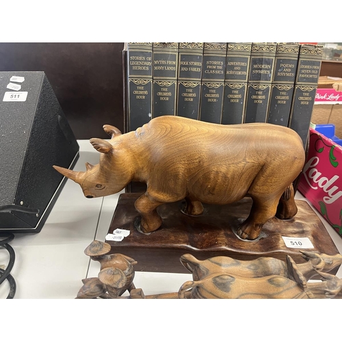 510 - Carved wooden animals to include large rhino