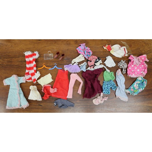 448 - Large collection of vintage Sindy, Barbie clothes, furniture, pram etc