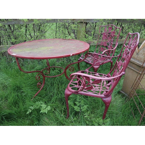 192 - Circular metal garden table together with 2 chairs