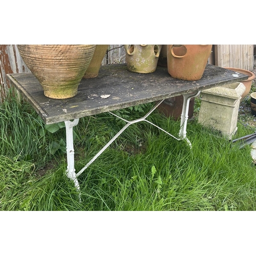 210 - Wooden top and cast iron base garden table - Approx size: L 120cm W 61cm H 71cm