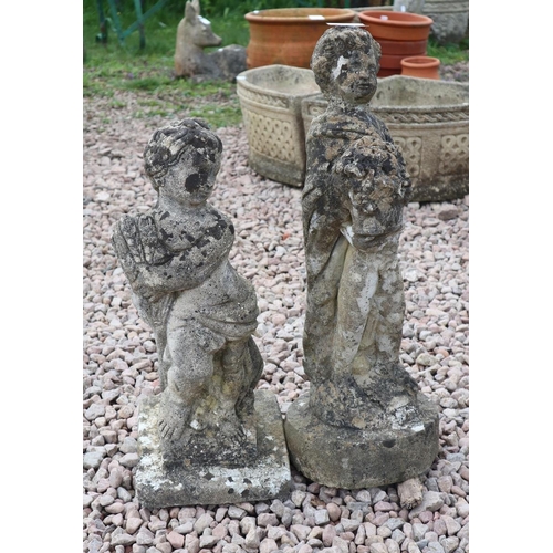25 - 2 small stone boy figures