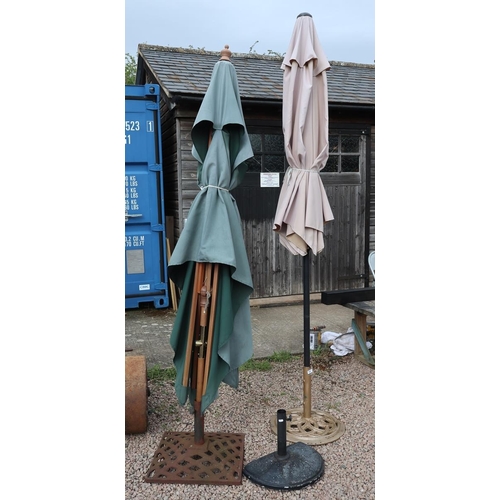 330 - 2 garden parasols with heavy metal bases