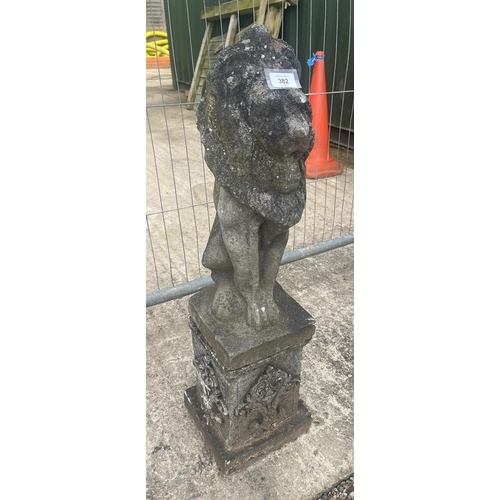 382 - Stone statue of lion on stone plinth